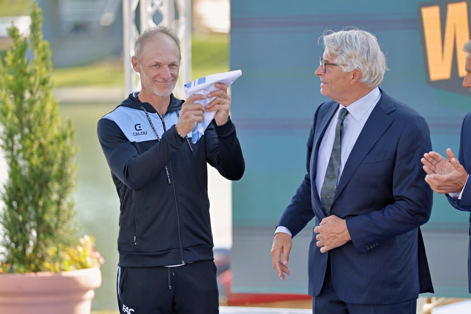 Mauricio Caffa receives the ICF flag at the handover ceremony in Gyor Mauricio Caffa Canoe Marathon Argentina Gyor 2025